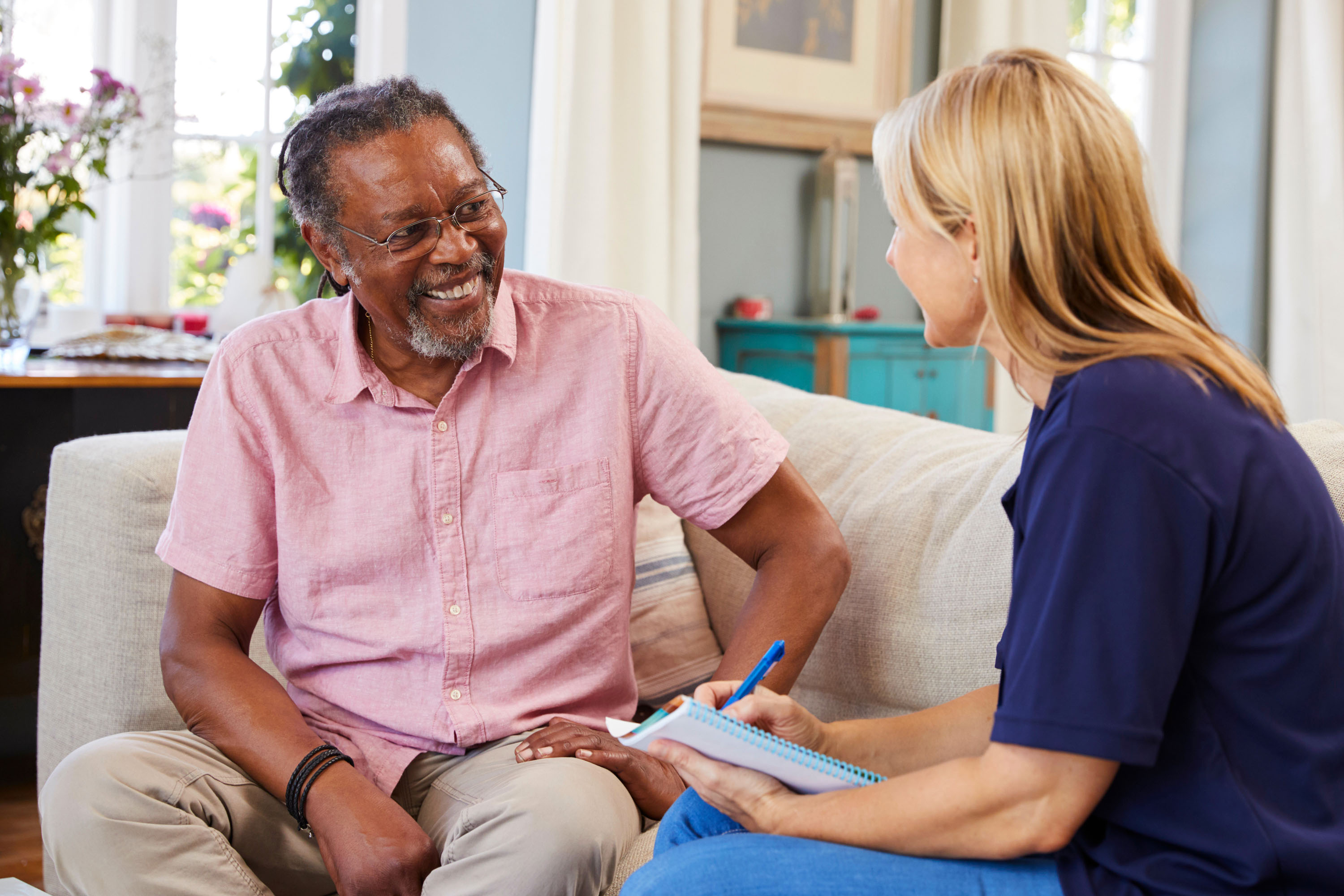 A nurse asking a man some questions