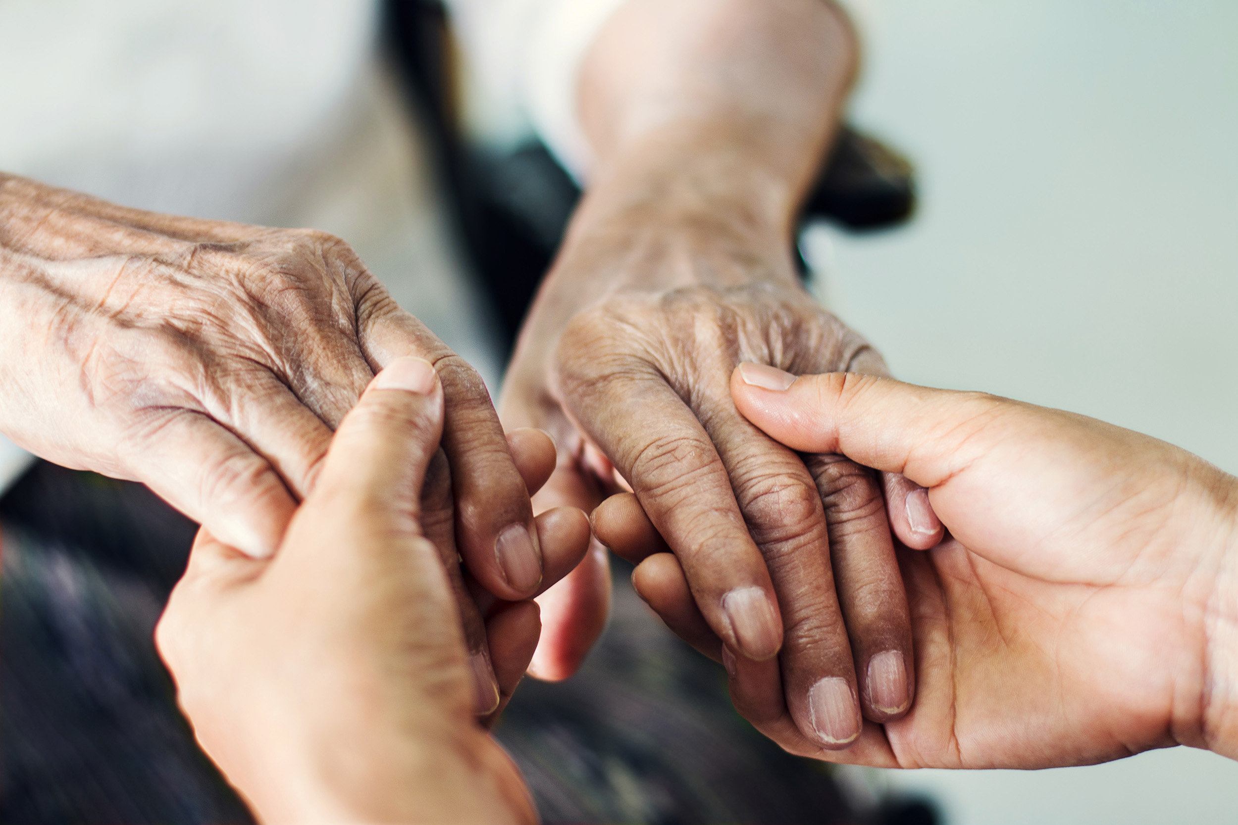 Two people holding hands